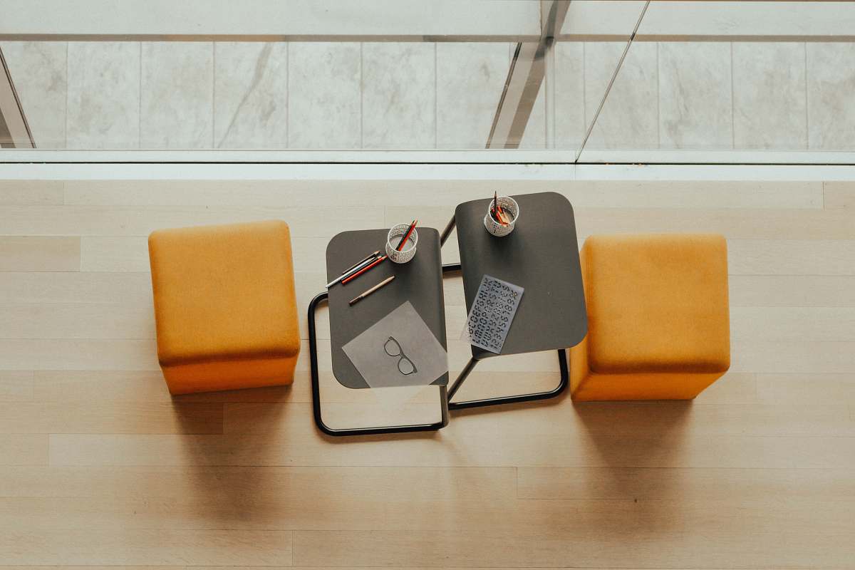 new york two orange ottoman chairs near gray side tables the museum of modern art